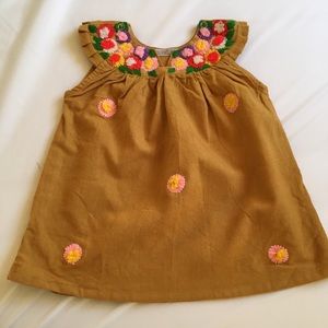 Hand crafted daisy embroidered dress. 100% cotton.